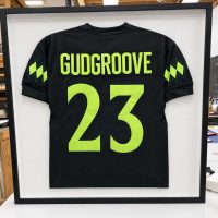 Framed football jersey Football jersey mounted and framed in a black shadowbox