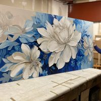 Large canvas stretching A large floral canvas being stretched in the Bluegrass Frames workshop