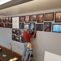 Onsite installation Framed pieces installed on a wall by Bluegrass Frames