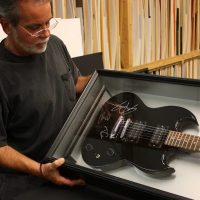 Signed guitar shadowbox Signed electric guitar mounted in a shadowbox frame